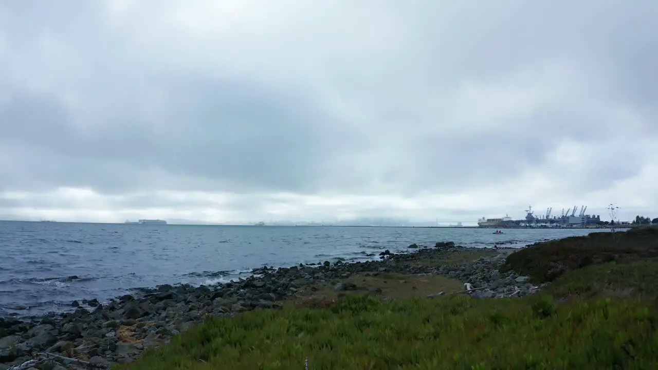 Beautiful scene near the bay and marina with Naval ships in the distance