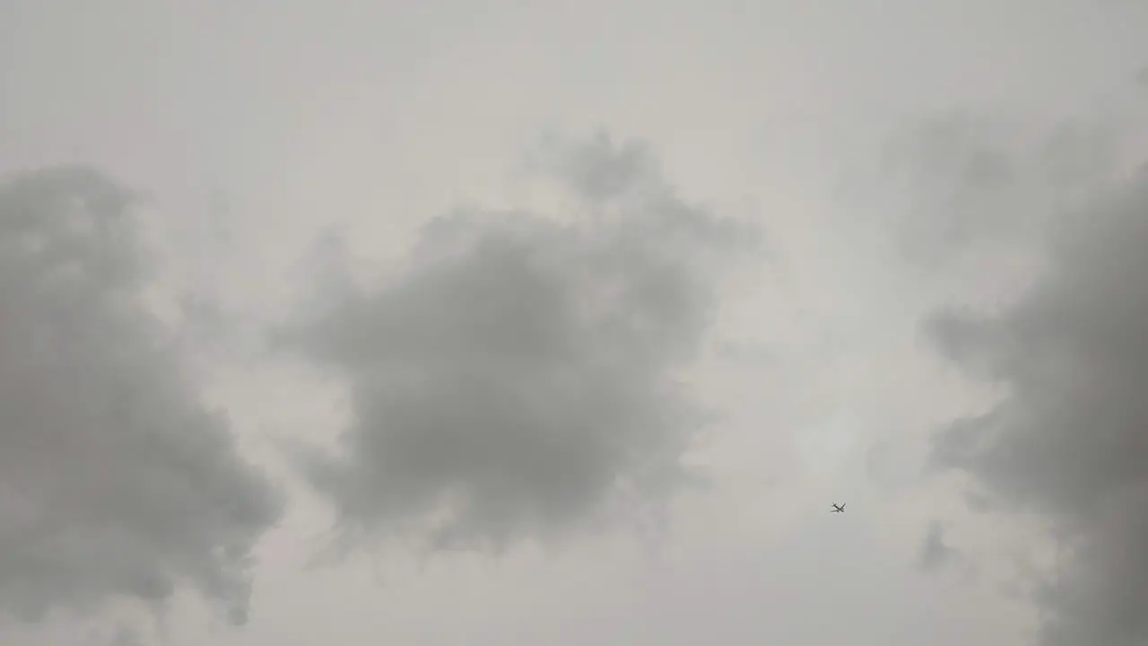 A plane flew over the dark clouds