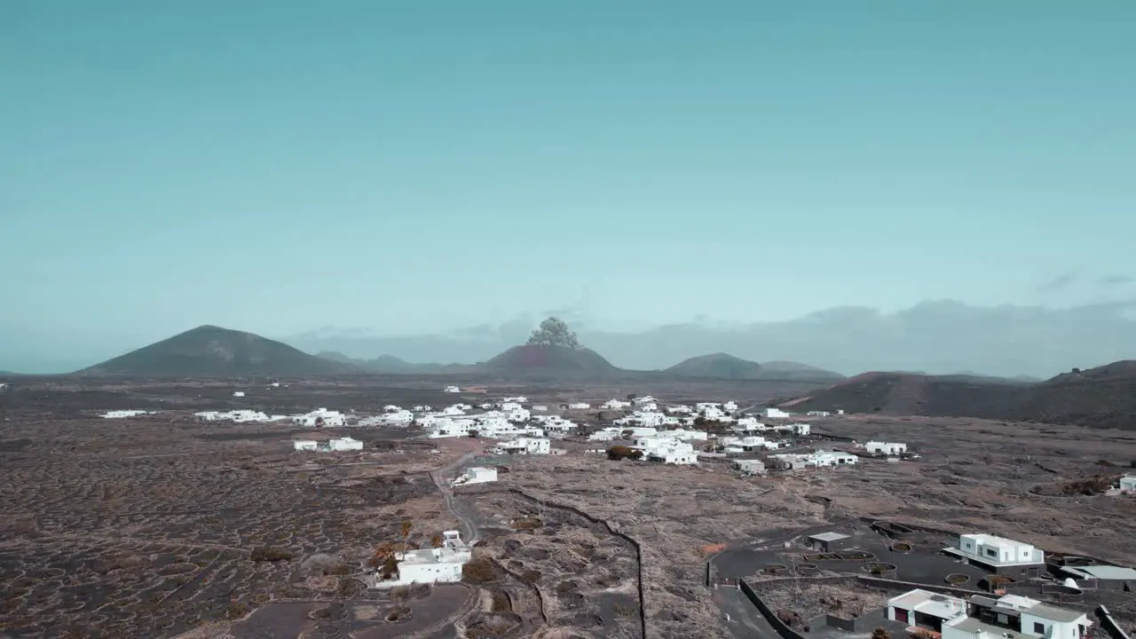 Aerial view of volcanic eruption with fireball ash and shock wave in desolate area