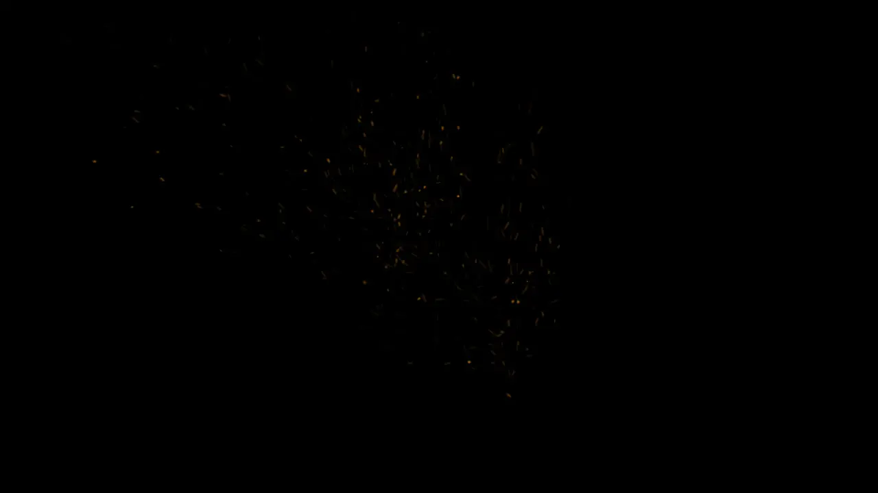 Sparks of fire rise from the black background Transparent alpha channel