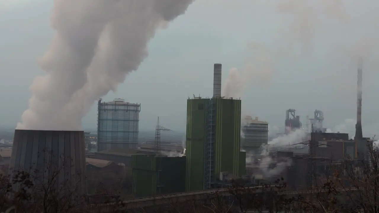 Steam rising from cooling tower at large German steel factor in Duisburg NRW