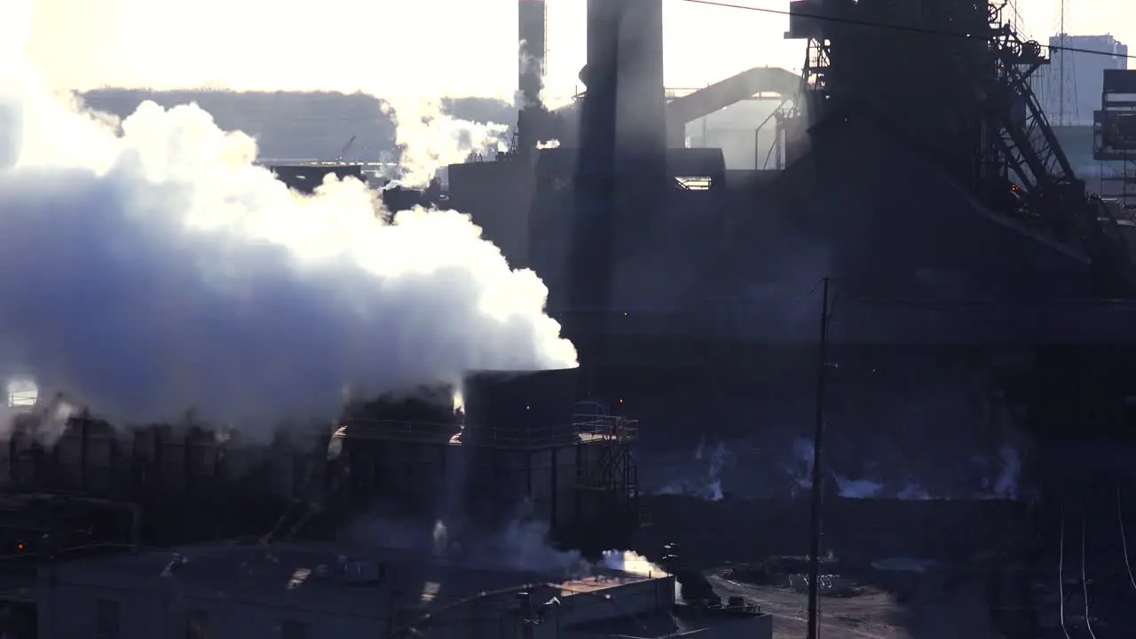 Establishing shot of a busy steel mill with ore transported through an aerial skyway 1