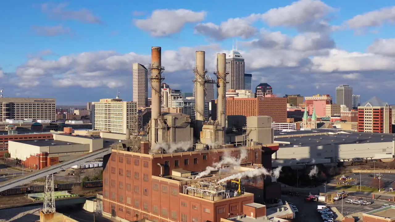 Nice drone aerial of downtown Indianapolis Indiana with industrial factory in foreground 4