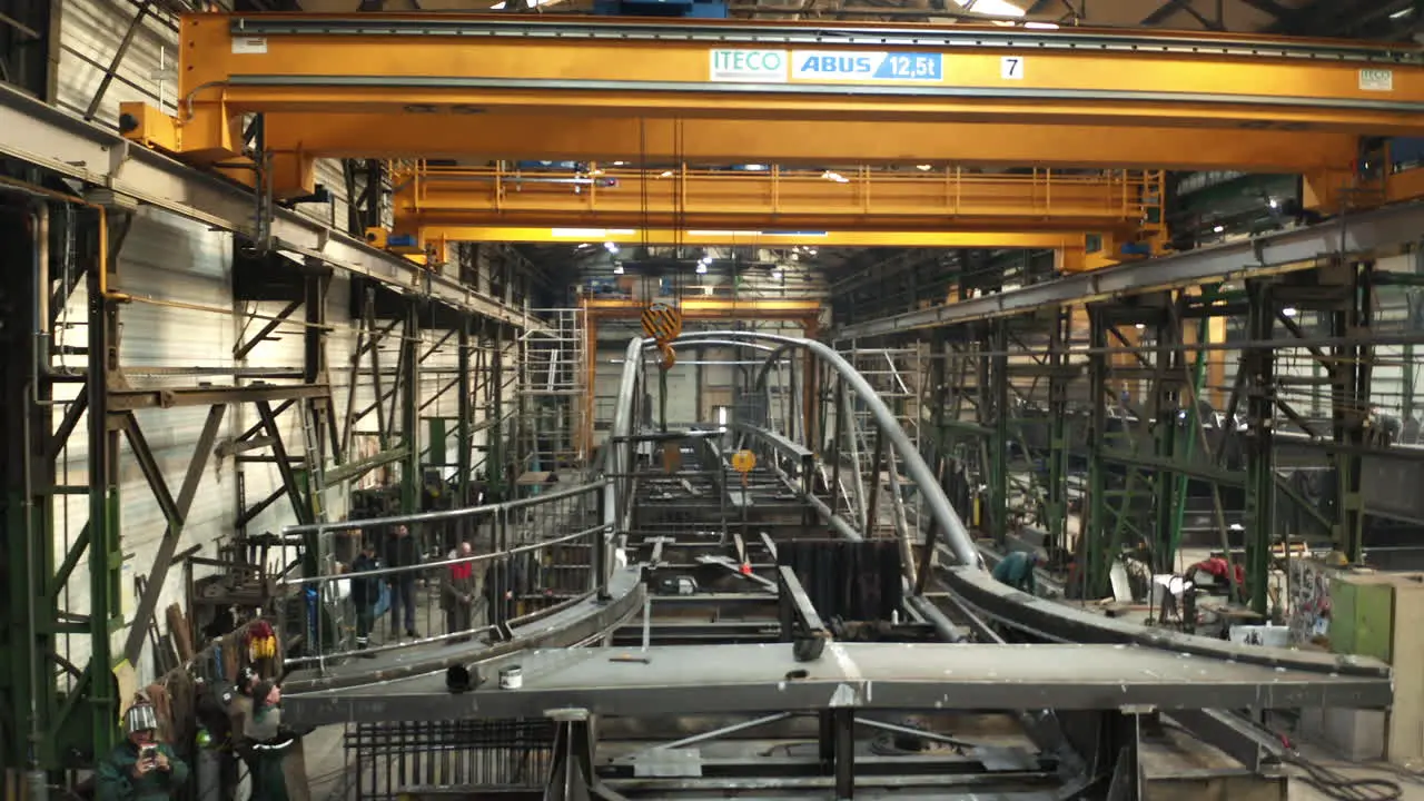 Fabrication of new steel bridge in industrial steelworks factory hall