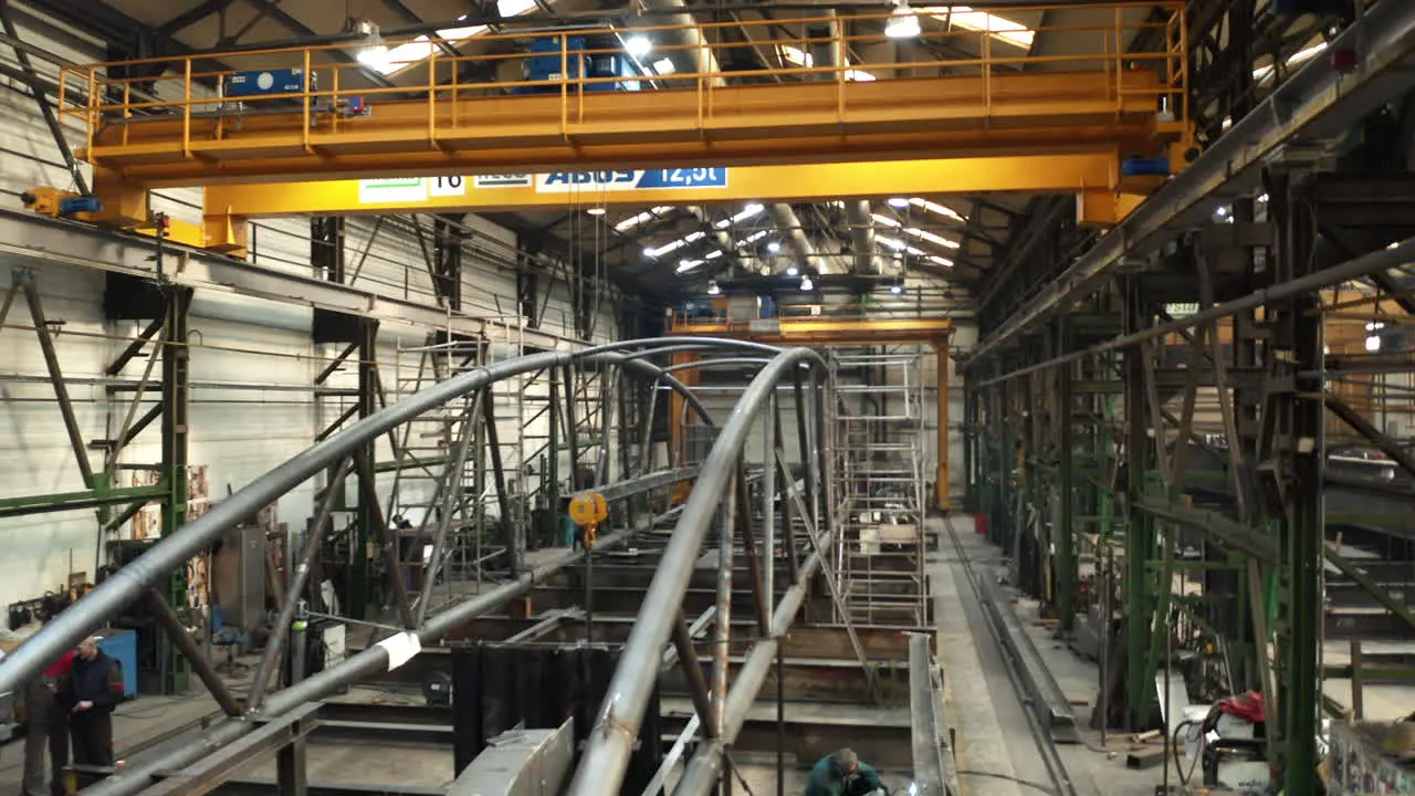 Steel bridge arch in industrial manufacturing steelworks factory hall