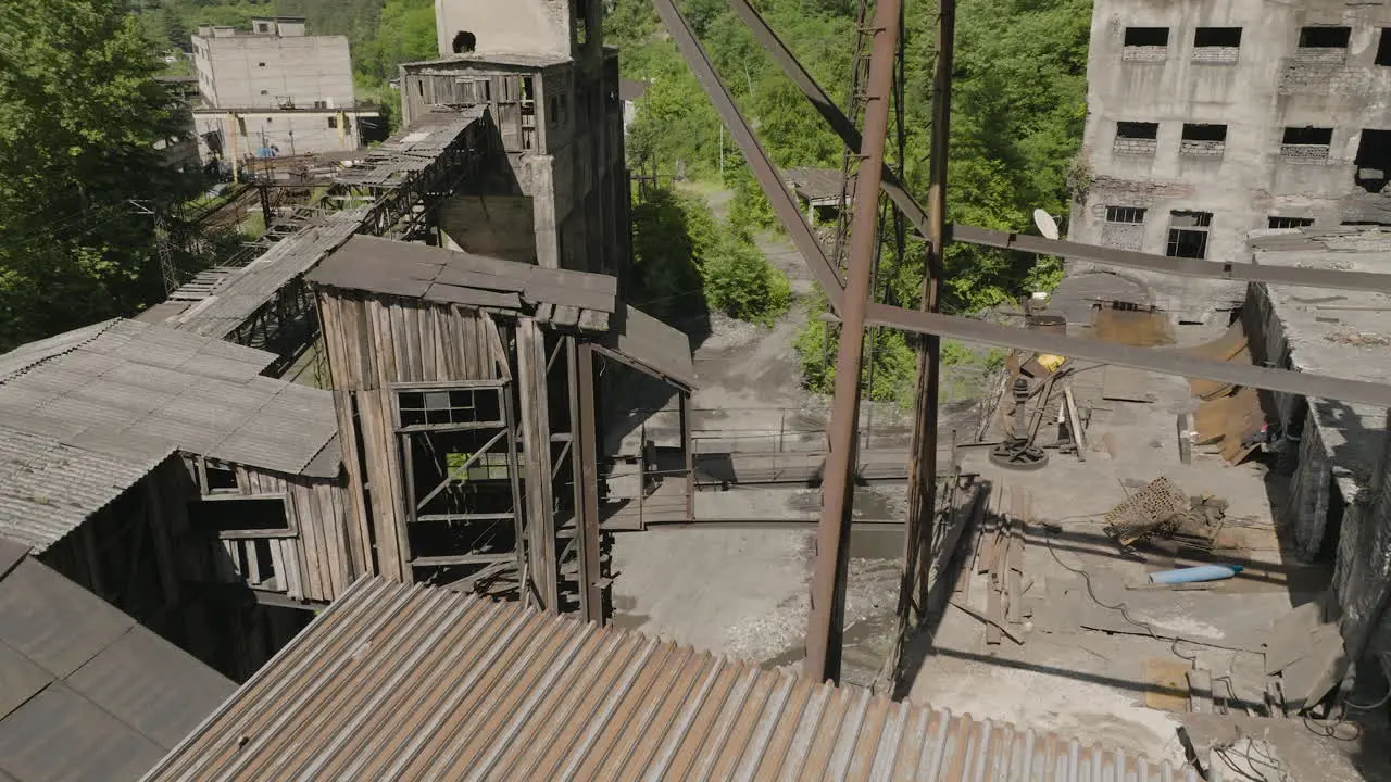 Rusty sheet metal sheds and skywalk bridge in abandoned factory