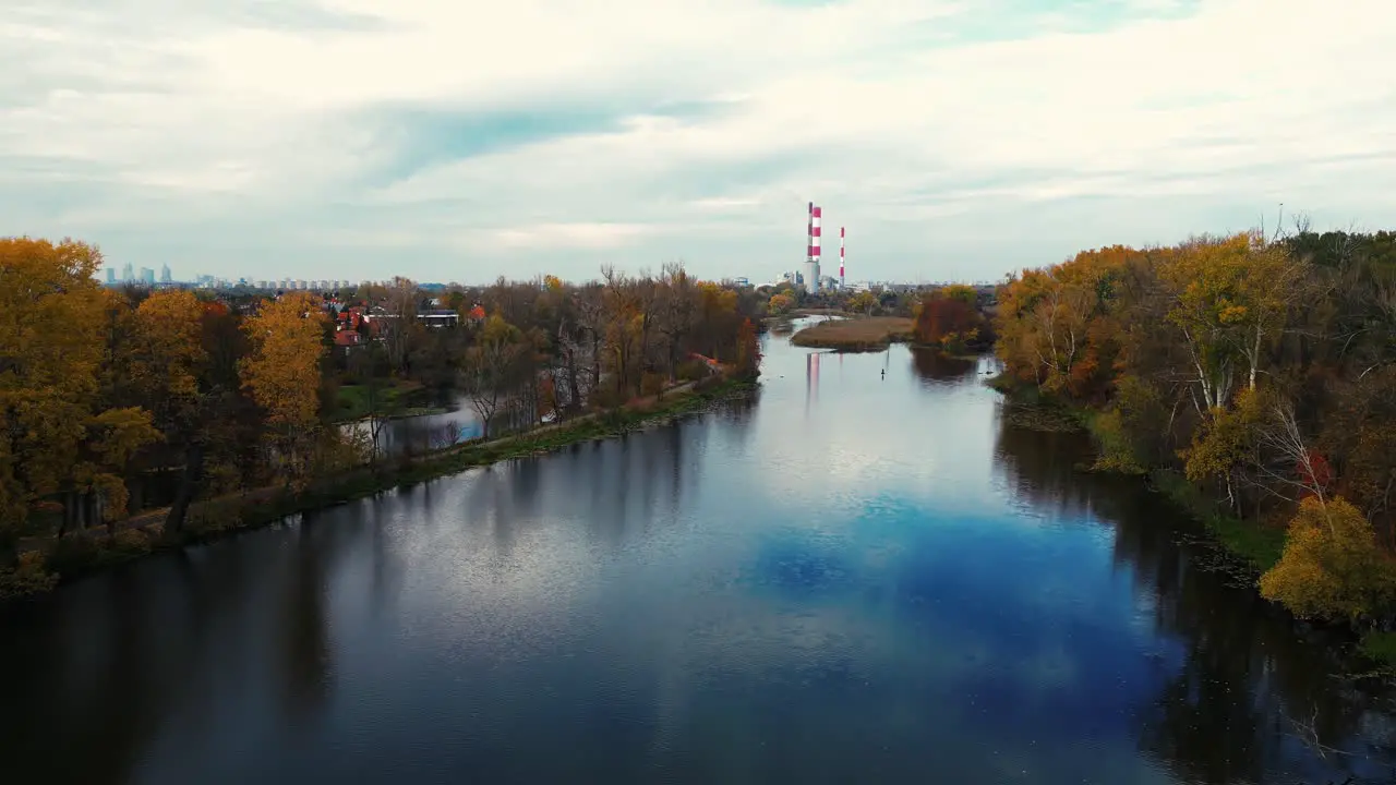 Aerial view of coal power plant high pipes with black smokestack polluting atmosphere