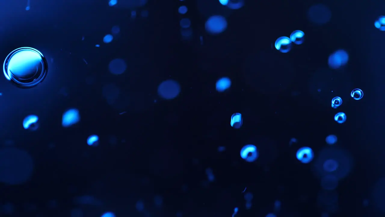 Abstract science or art background with blue bubbles rising