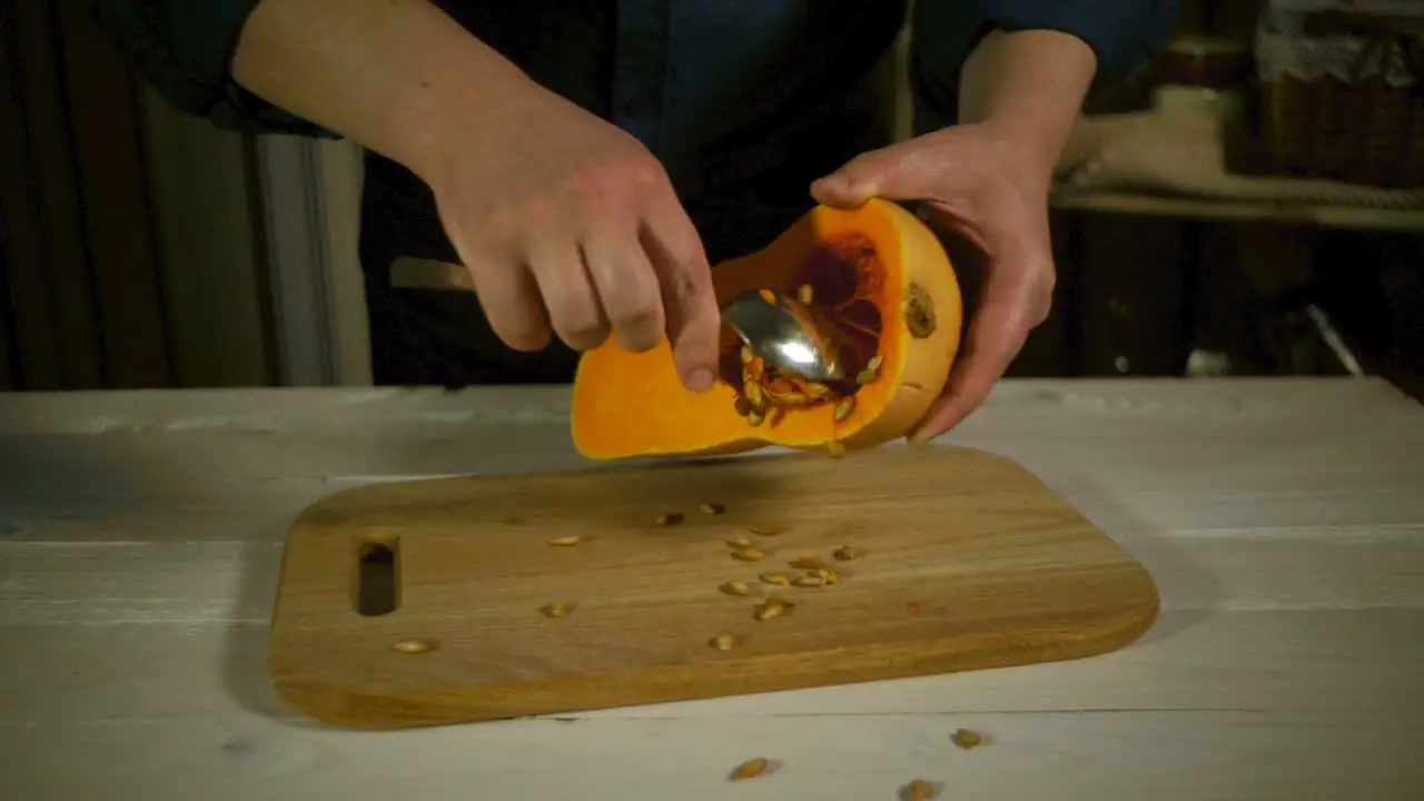 Man preparing to cutting orange pumpkin Cutting fresh pumpkin