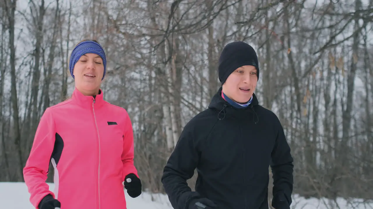 Happy young couple married sports morning and evening jogging in the park