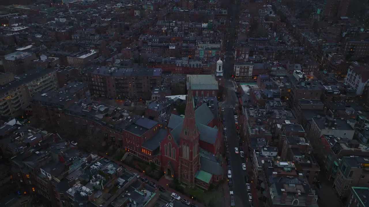 Aerial slide and pan shot of Church of the Advent in residential urban development High angle view of apartment houses around Boston USA