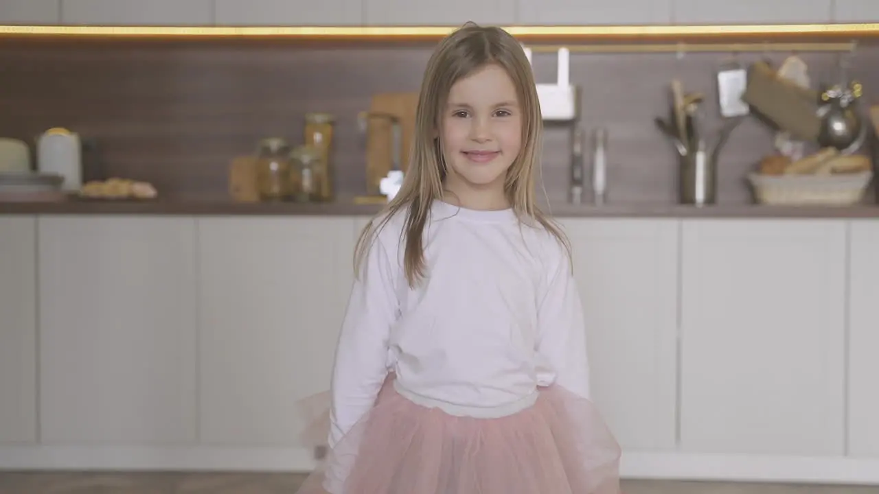 Little Daughter Dressed As Princess Posing At Home