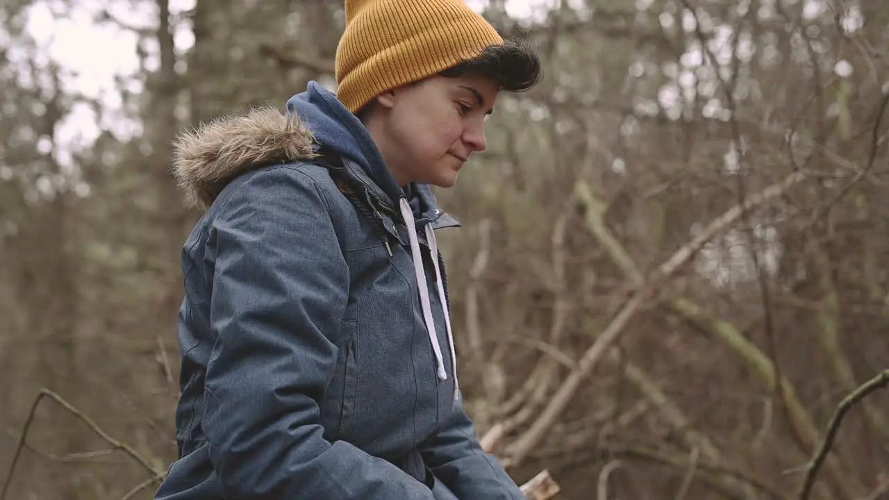 A Young Female With Short Hair Drinks A Hot Beverage In The Forest 1