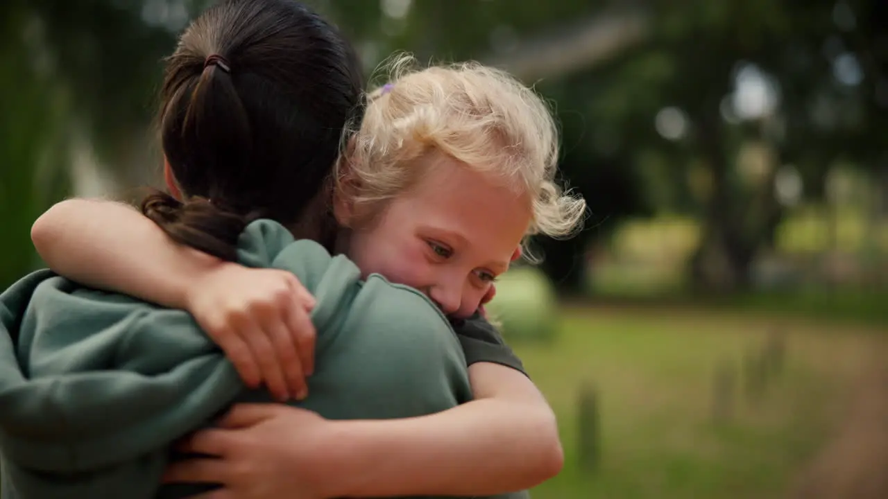 Child mother and hug at a park outdoor in nature