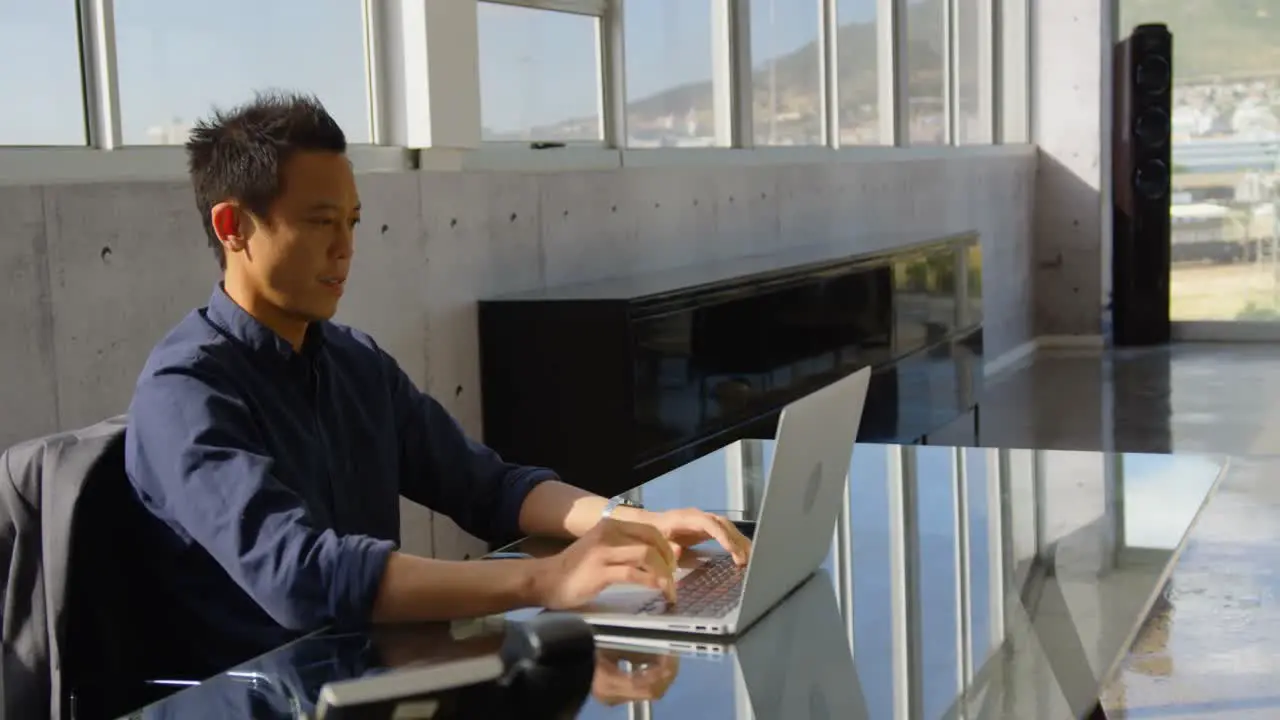 Young Asian business male executive working on laptop in office 4k