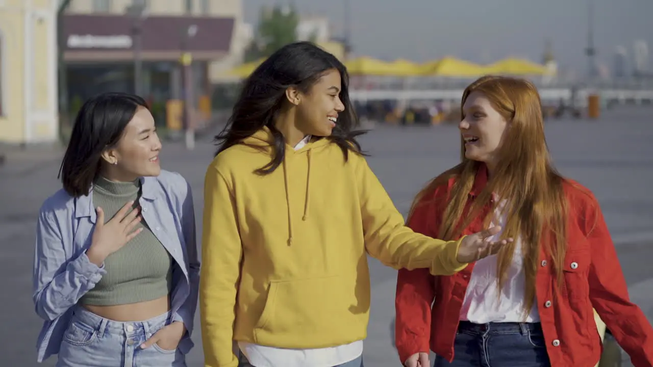 Multi Ethnic Female Friens Walk Together Outdoors