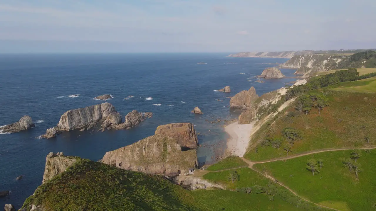 Aerial View Of Beautiful Wild Cliff Coastline On A Sunny Day 1