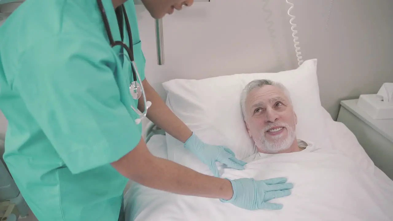 Bedridden Patient Feels Comfortable And Safe With His Nurse An Unrecognizable Young American Girl