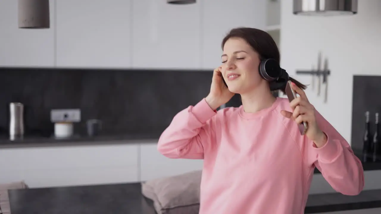 Energetic Dancing Of A Happy Girl At Kitchen