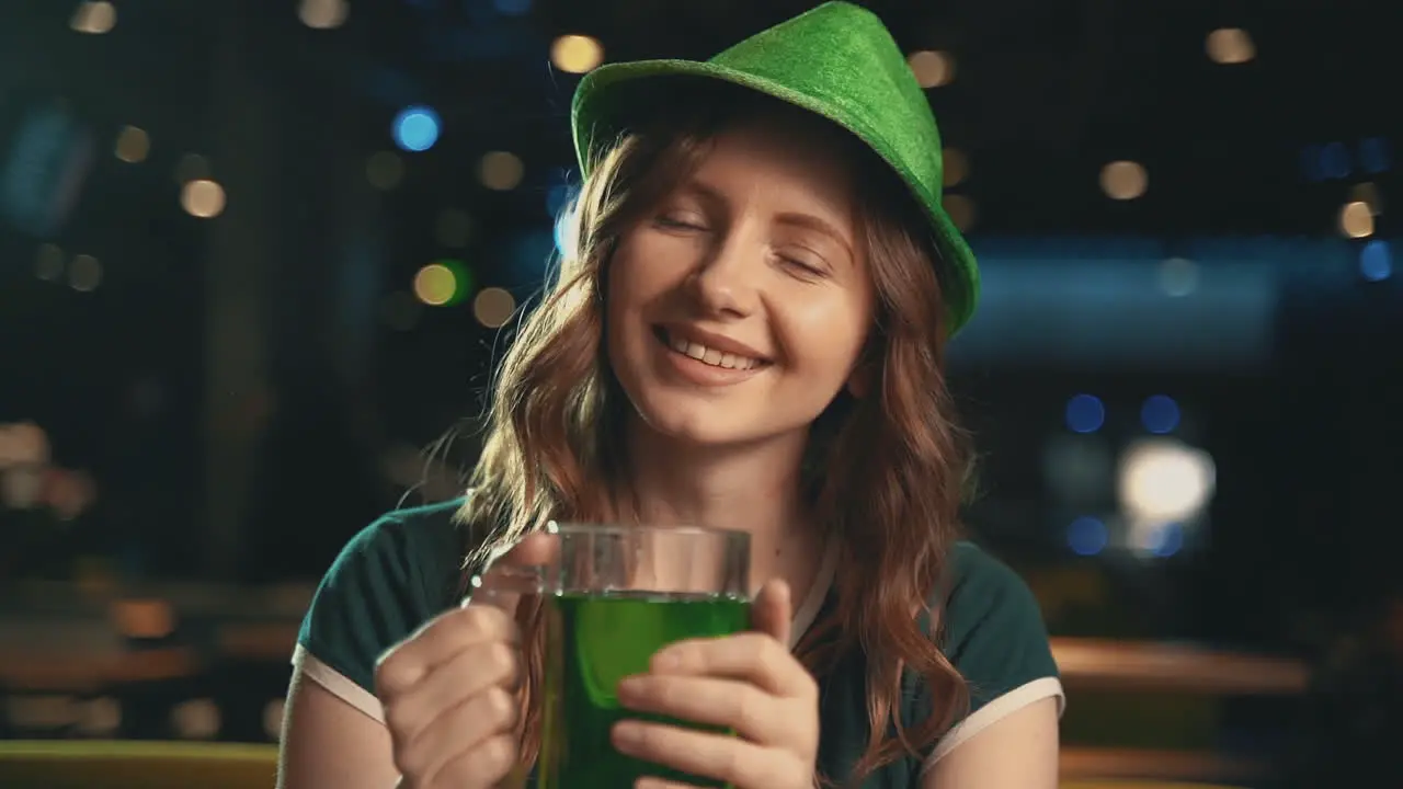 Portrait Of Pretty Young Woman With A Green Beer Mug And Wearing An Irish Hat