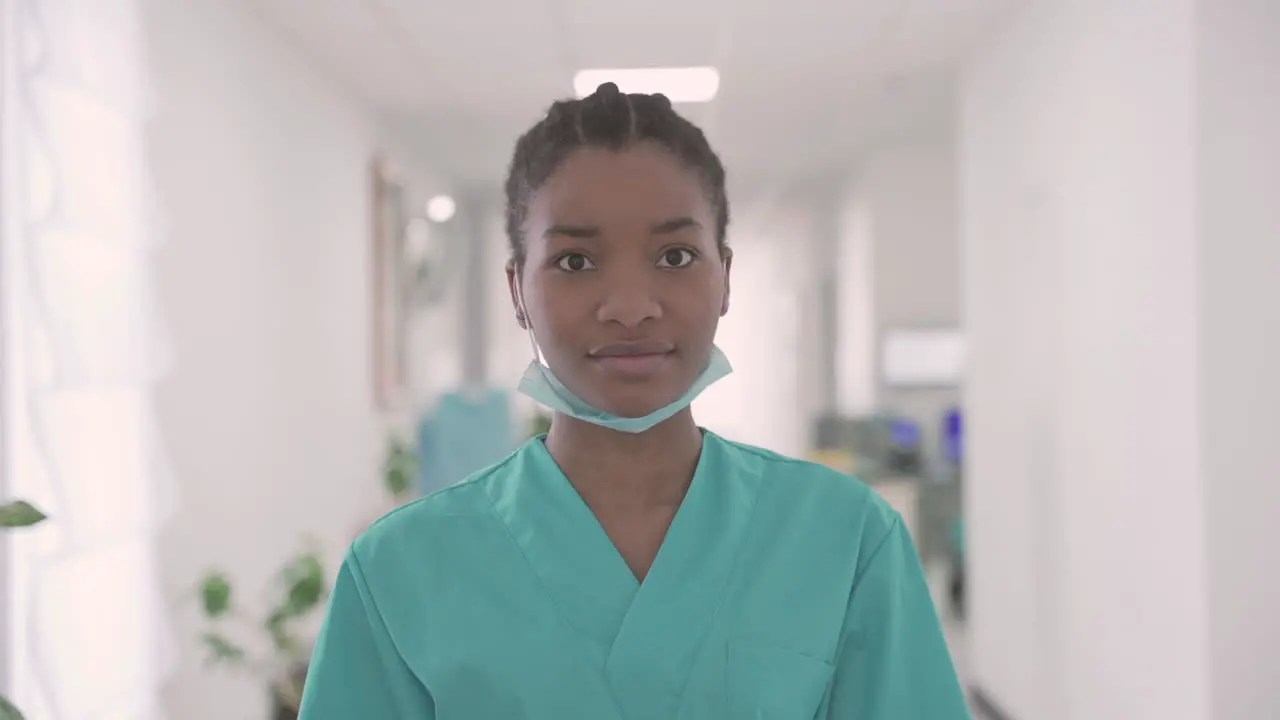 Young Woman Doctor Looks Directly Into The Camera And Smiles