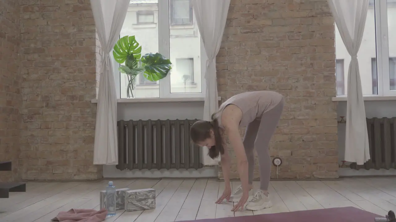 Old Female Doing Squats And Exercises At Home