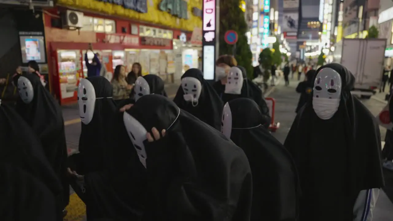 Crowd of Halloween Goers Dressed as "No-Face" Character in Shinjuku