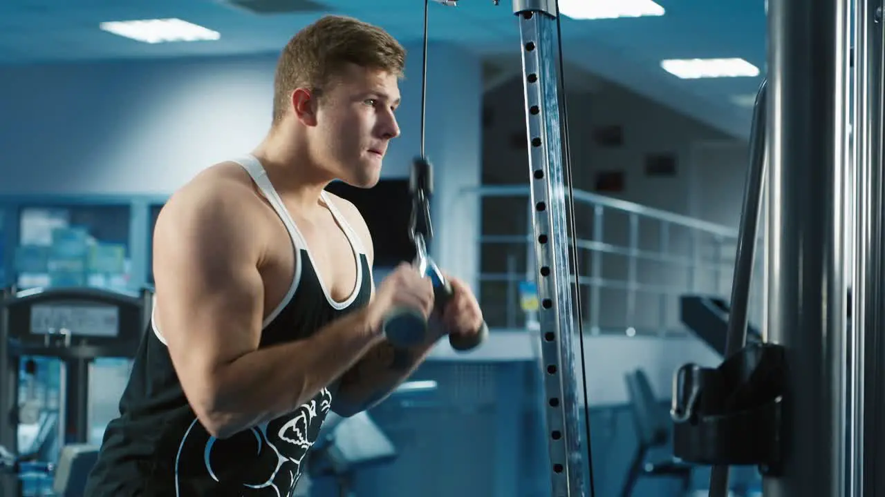 A young man trains in a gym