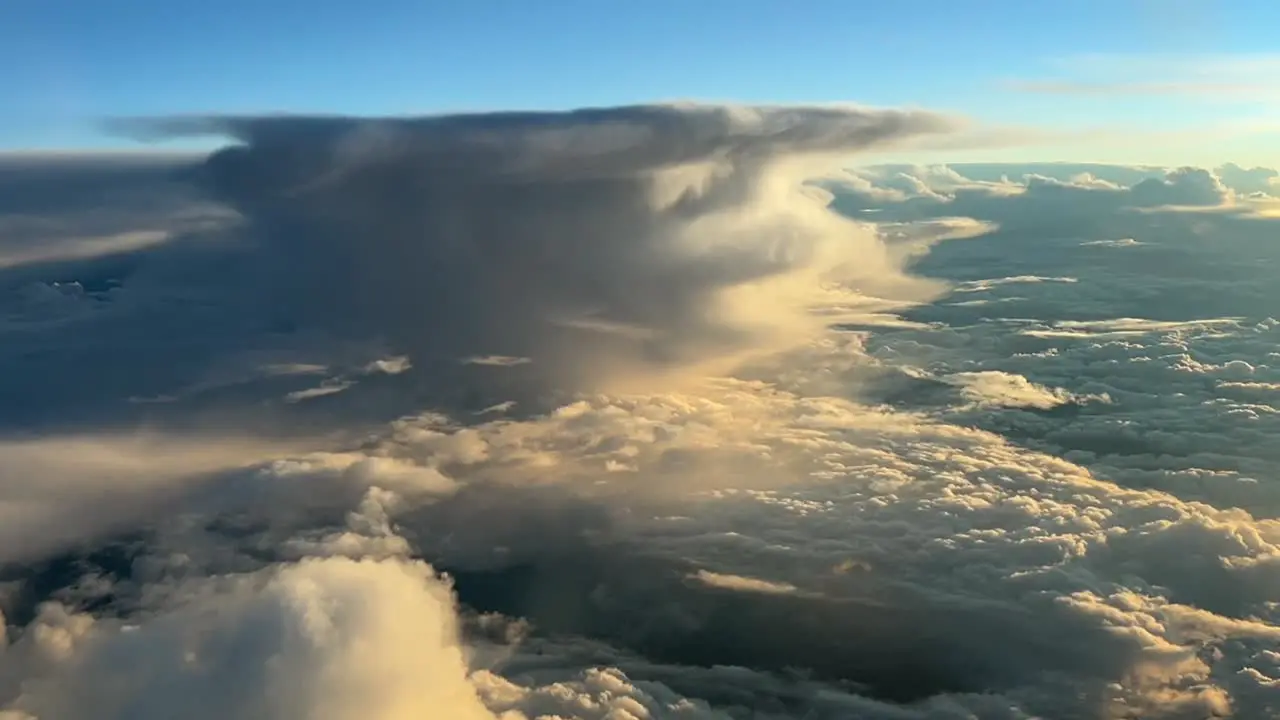 Aerial view from a jet cockpit of an awesome beautiful stormy sky and a huge cumuloninbus