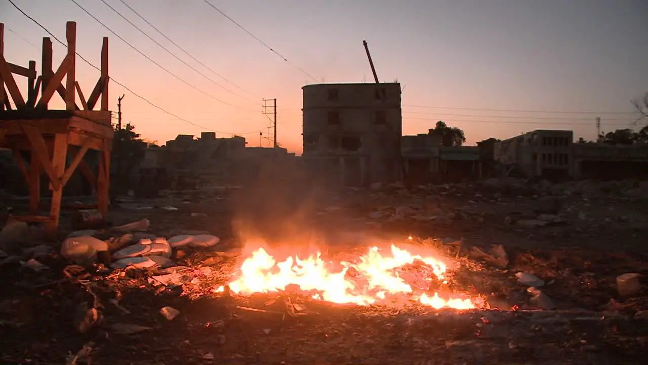 An open fire burns on the streets of Haiti following an earthquake