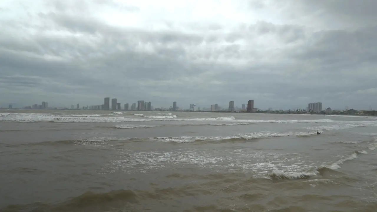 Tropical Sea Waves and Dramatic Dark Sky Above