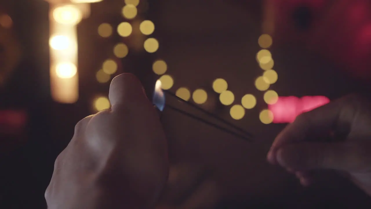 Lighting sparklers in the dark with a lighter