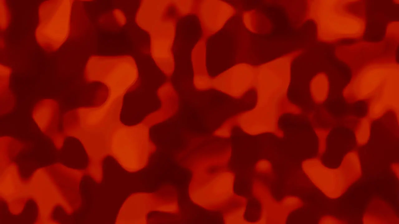 Looping animations of a bright orange and dark orange liquid camouflage like pattern