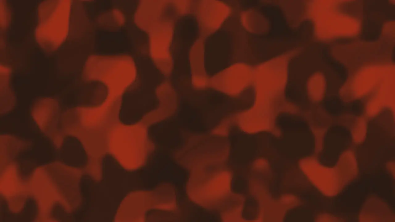 Looping animations of a orange and gray liquid camouflage like pattern