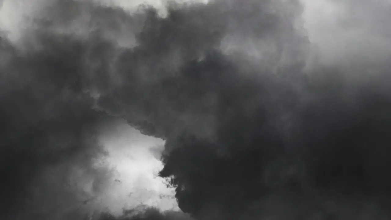 the view of the dramatic gray clouds of lightning striking