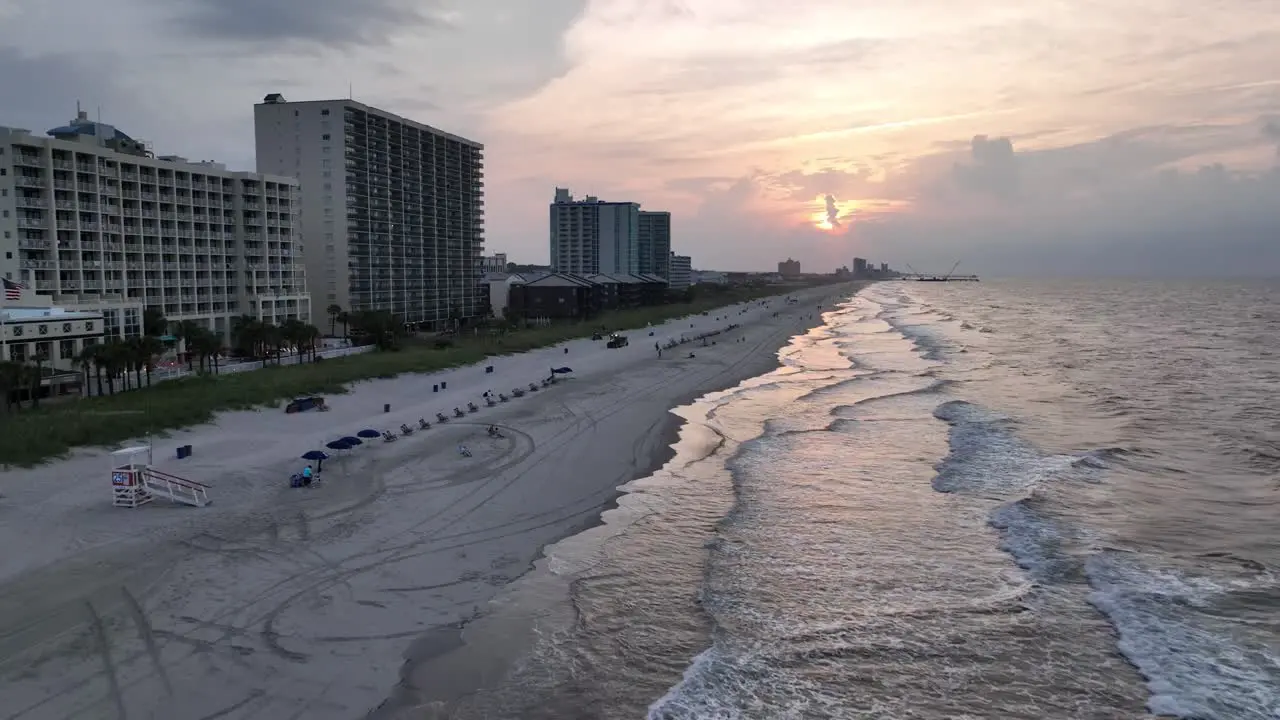 Fast aerial pullout north myrtle beach sc south carolina at sunrise over the surf