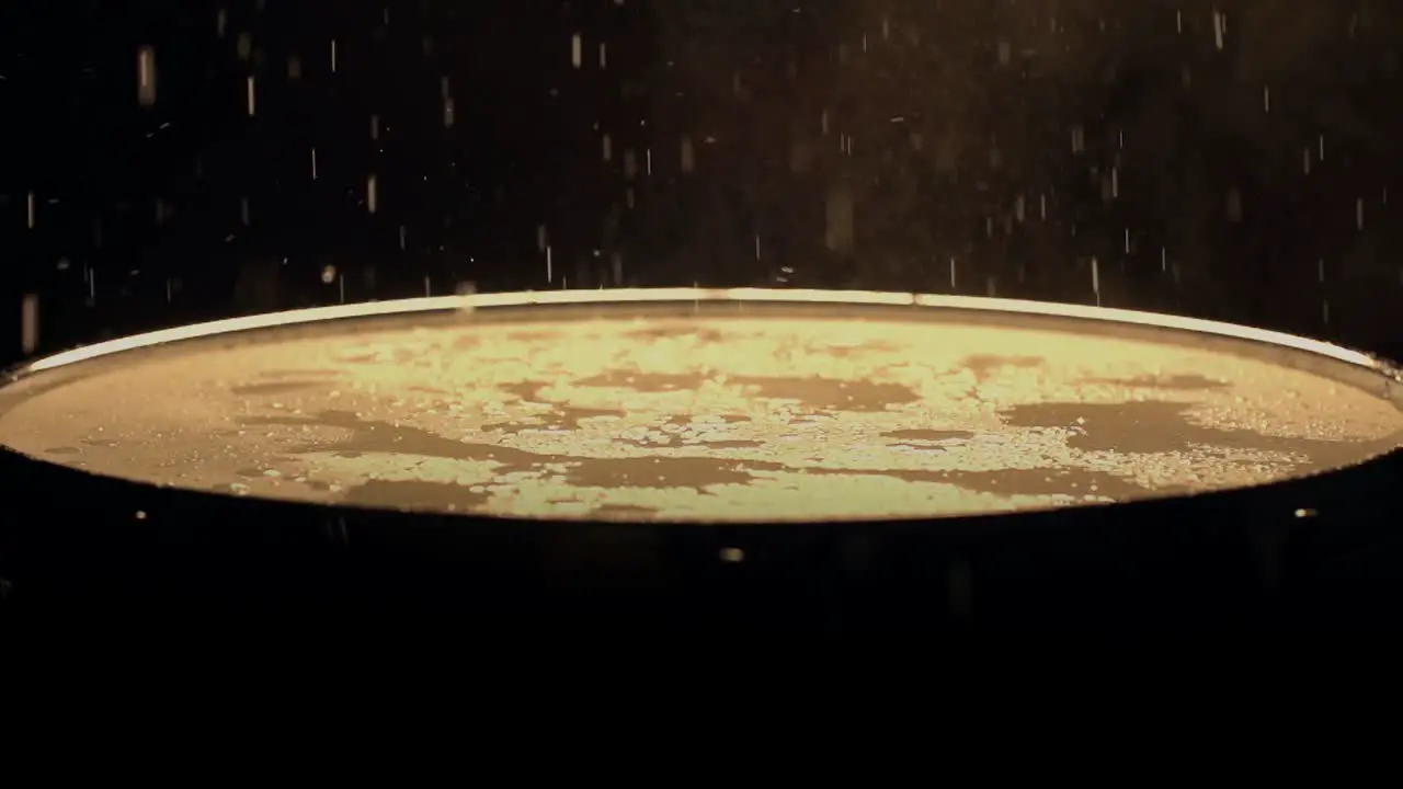 A slow motion of water droplets falling on a drum