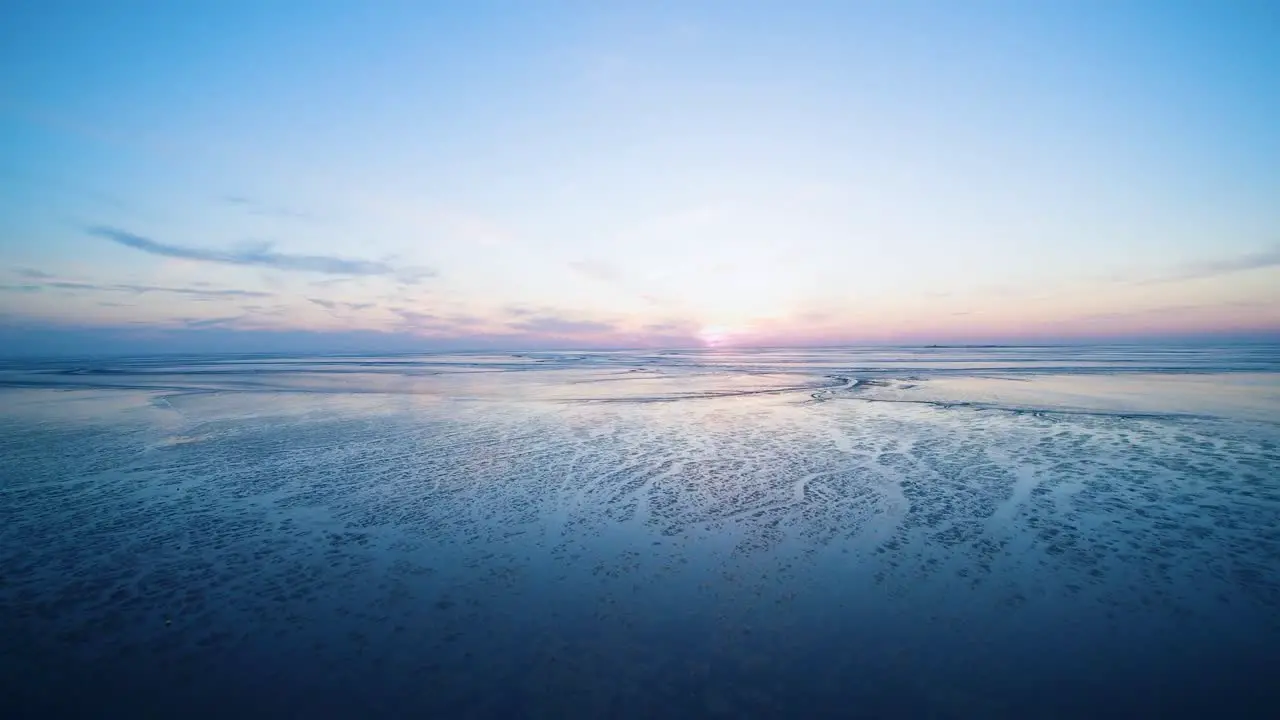 drone flight over the north sea after sunset