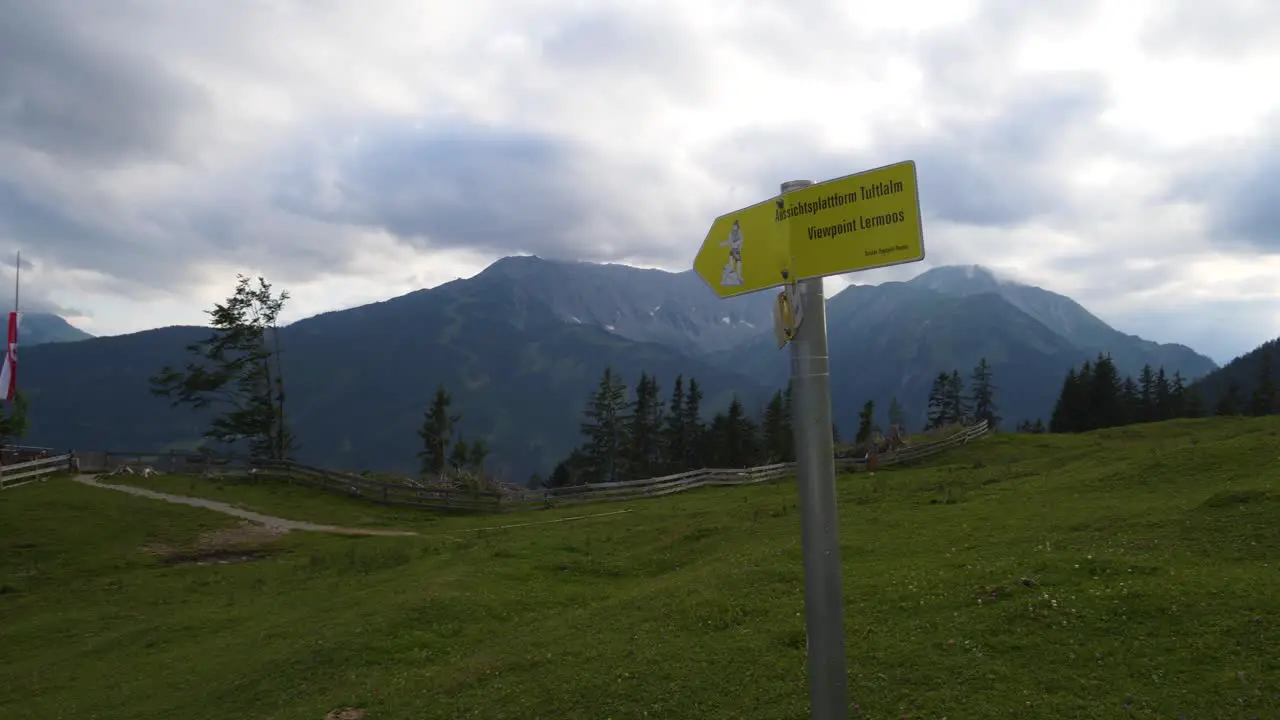 Tuftl Alm sign on trail in Austrian Alps