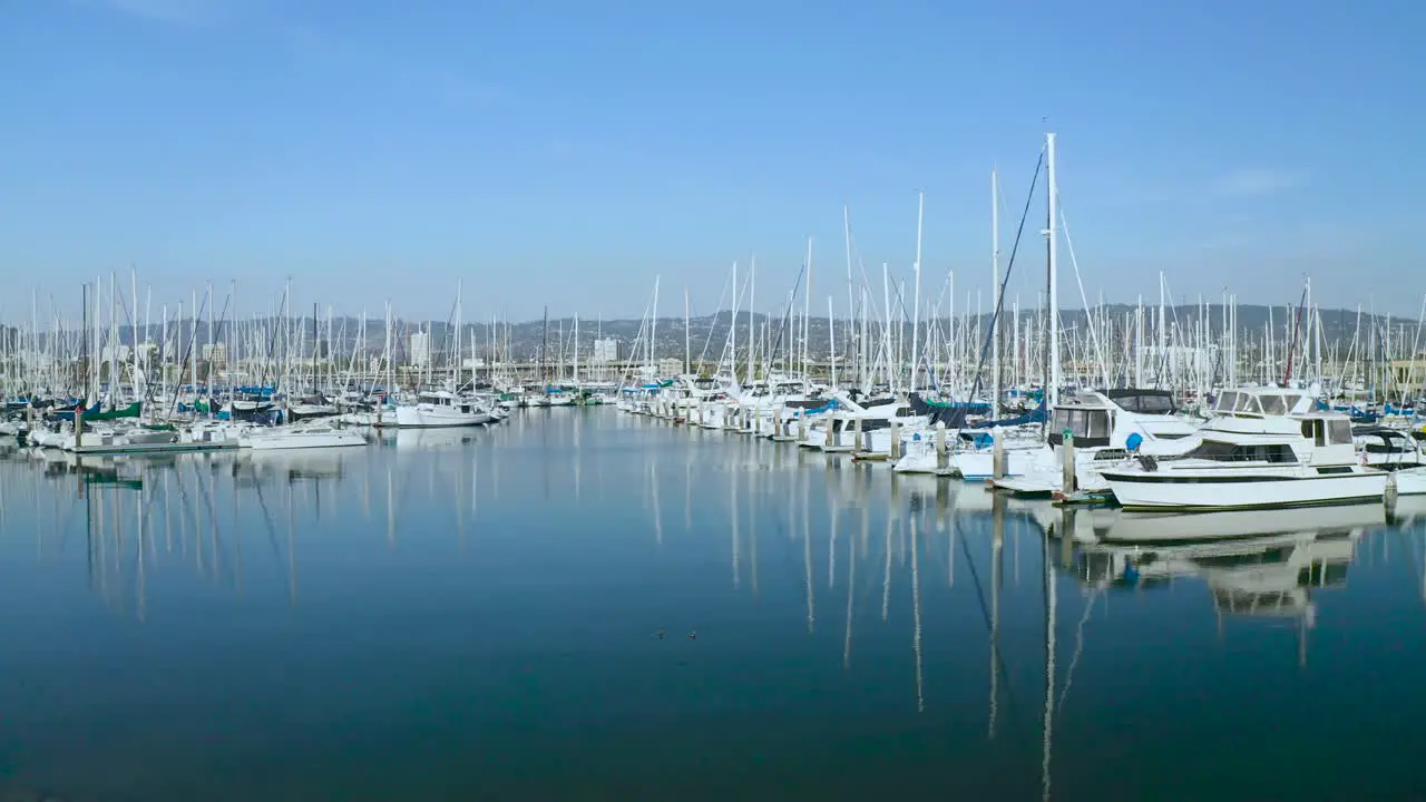 Slow pan to the left over boats in the marina