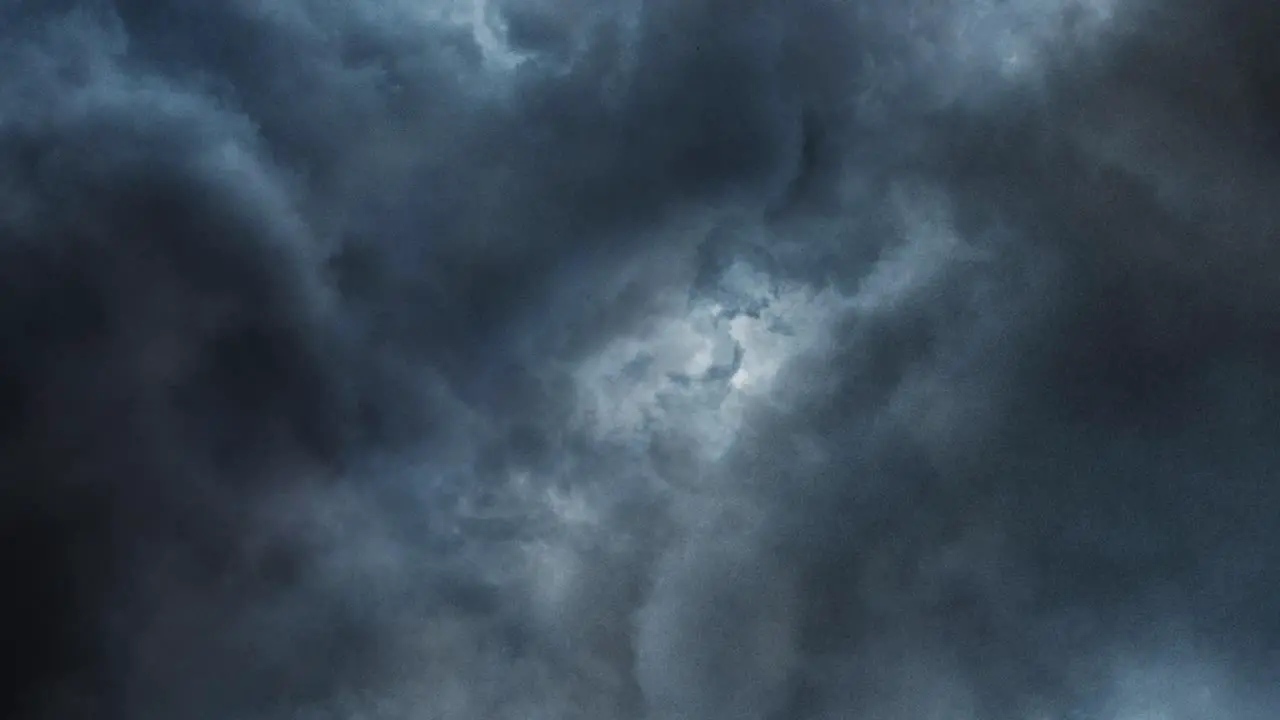 flying through the thunderstorm inside the dark clouds in the sky