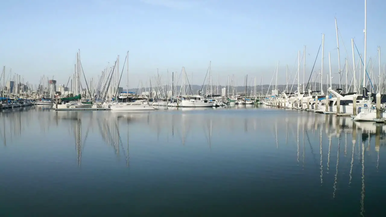 Rising up to meet the sunny day with sail boats across glassy waters