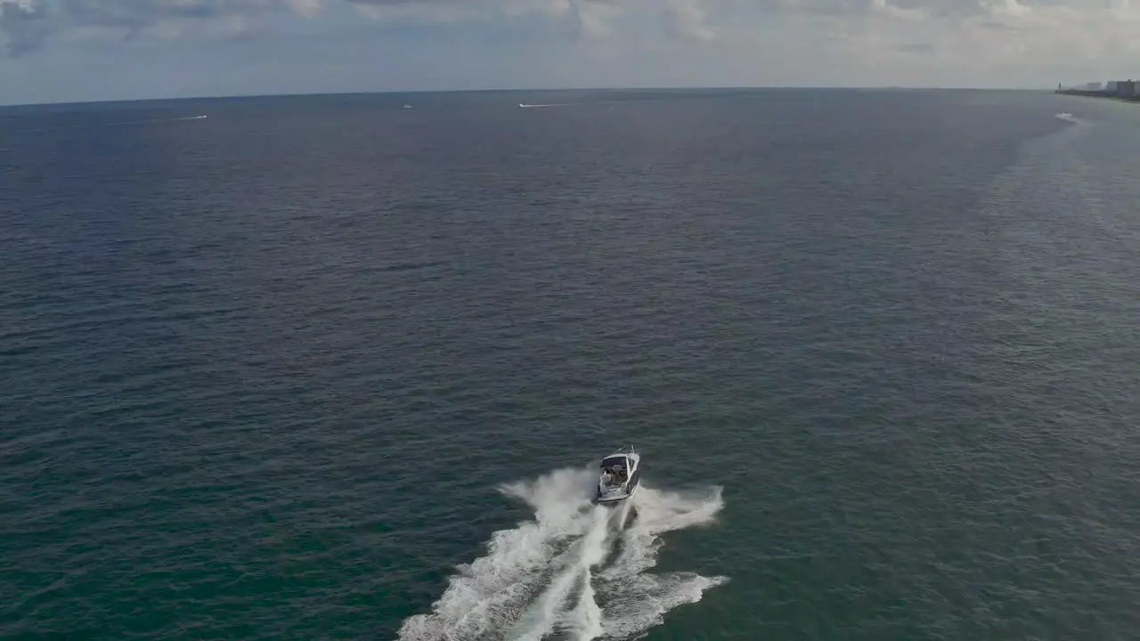 aerial of a big passenger boat driving off the coast of florida