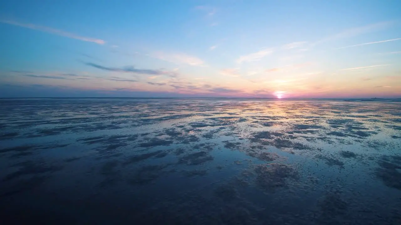 drone flight over the north sea at sunset