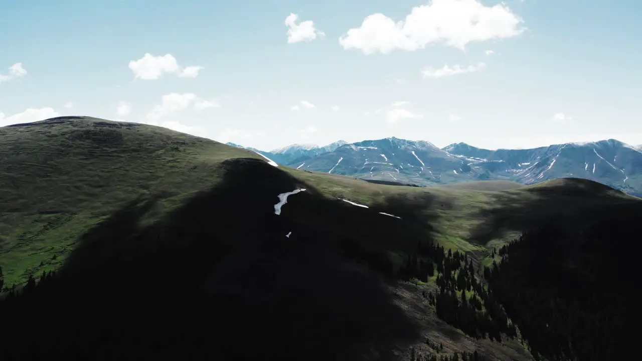 Drone in the mountains flying near clouds