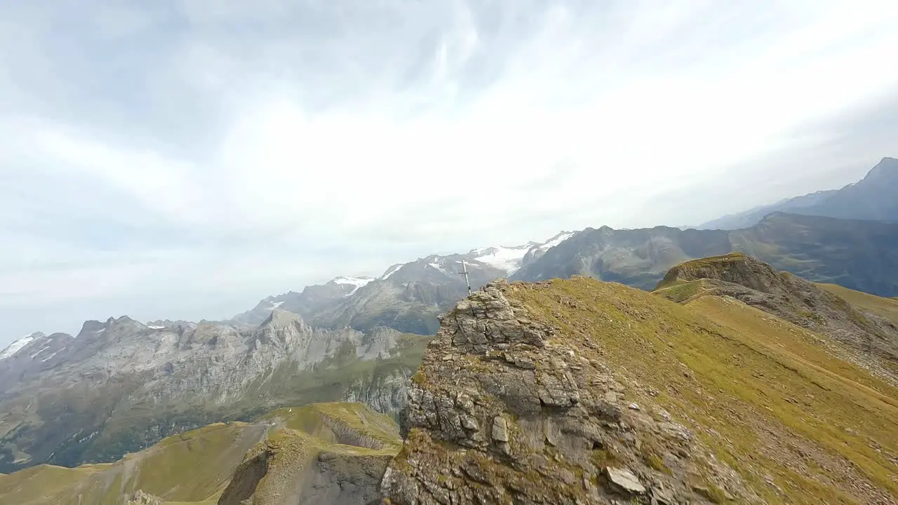 Flying down from a mountain summit to the valley