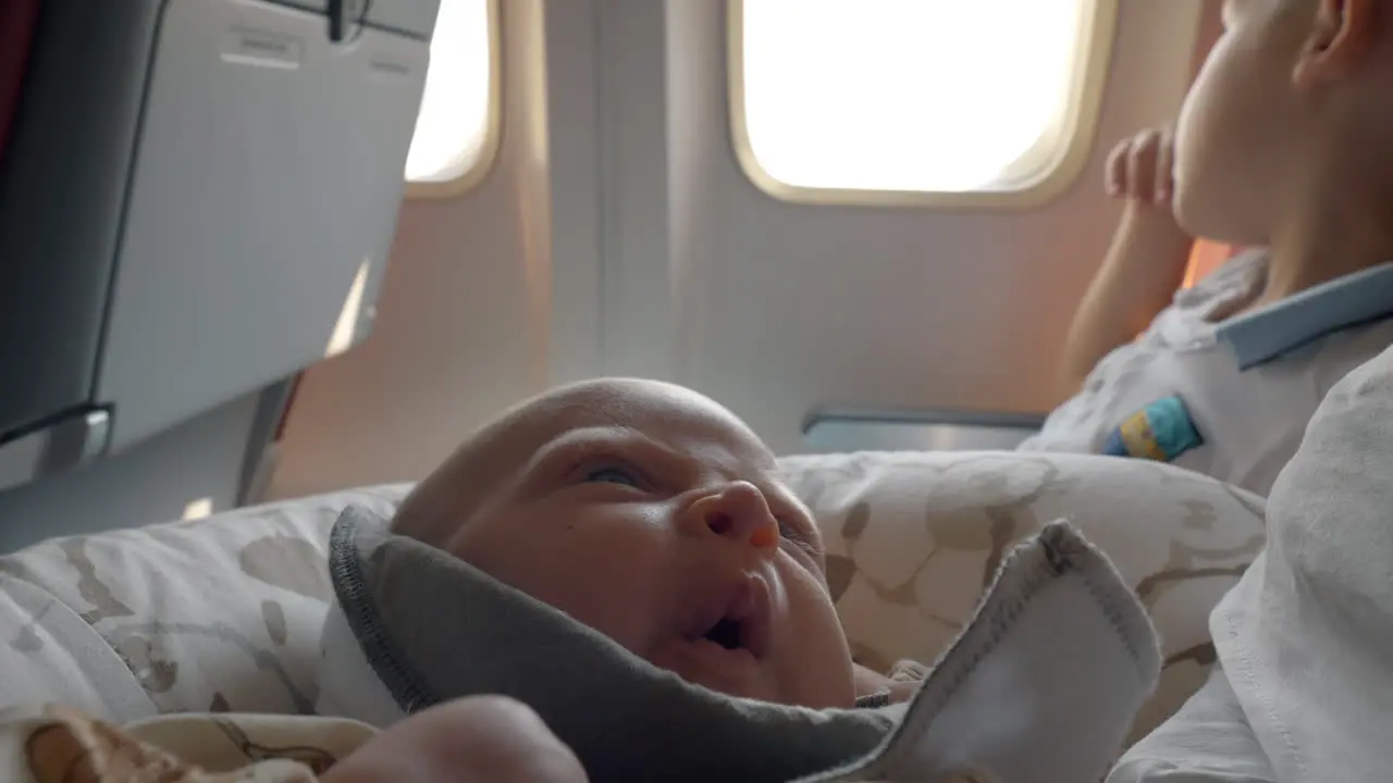 Sleepy baby in the airplane