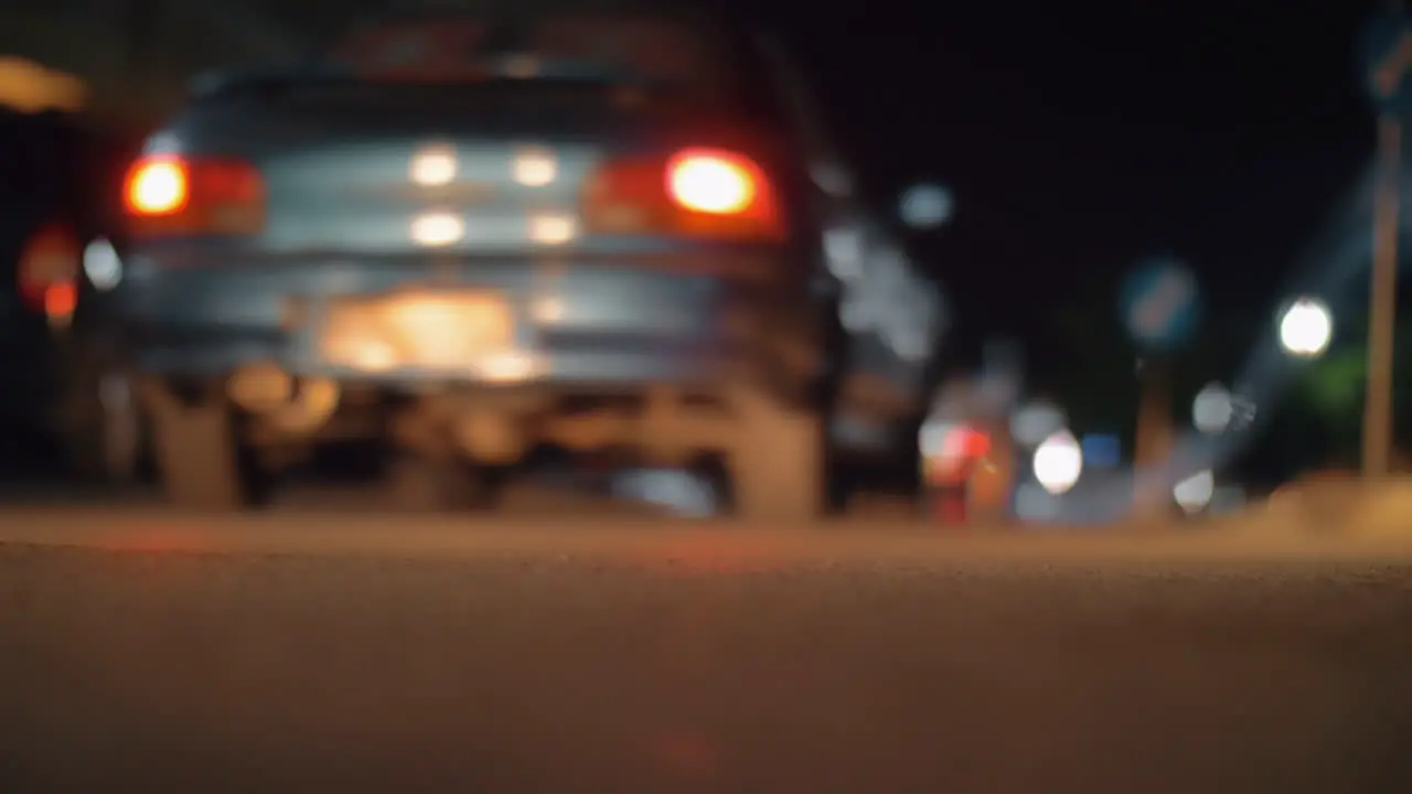 Night town and cars driving in the street