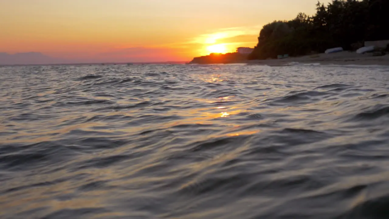 Waterscape with wavy sea at sunset