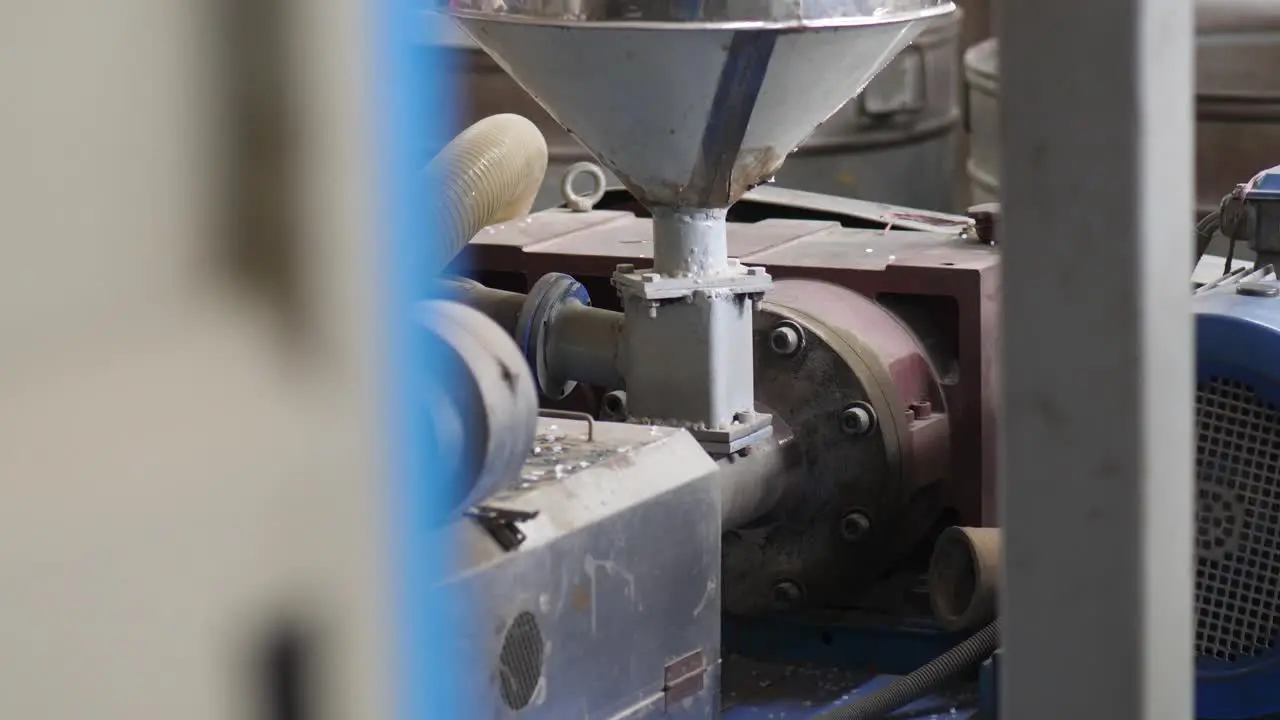 View Of Machinery Covered In Dust At Plastics Factory